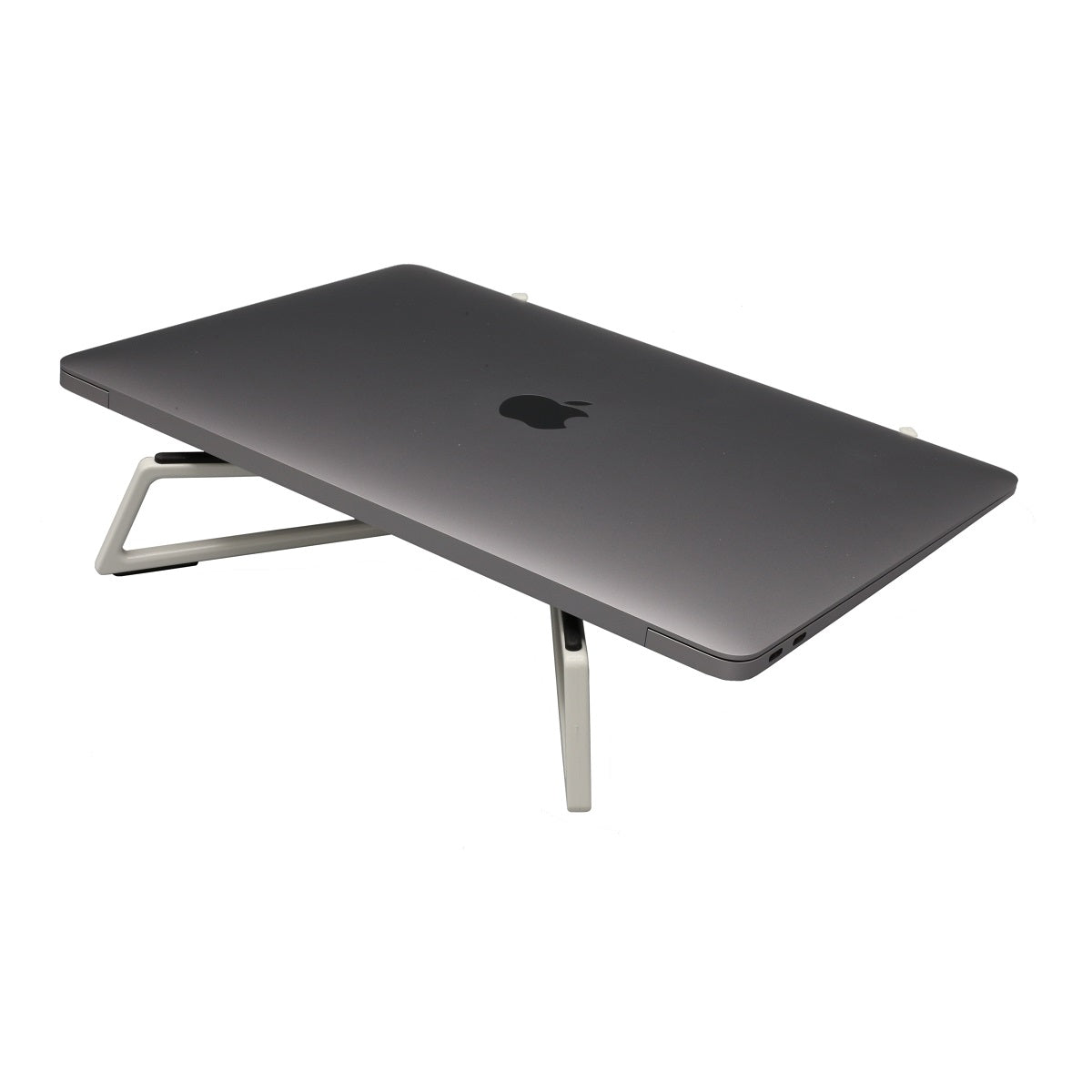 The Flexverk Laptop Stand is shown in Peral White expanded and supporting a closed Macbook Air on a white background.