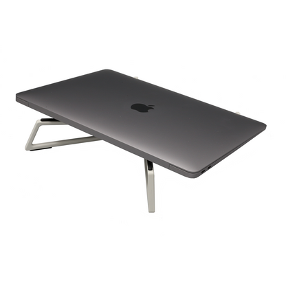 The FlexVerk Laptop Stand shown in Pearl White holding a Space Gray Apple Macbook Air on a white background.